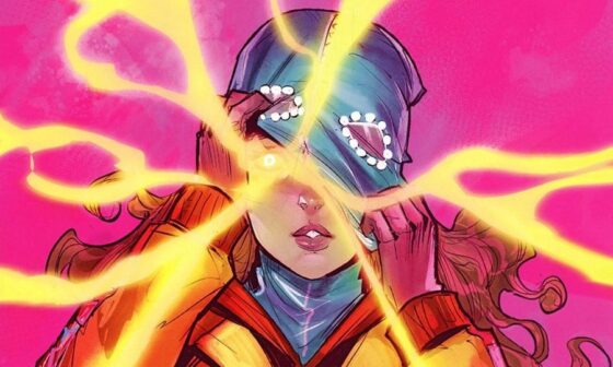 M.O.M.-Hauptfigur Maya Kuyper in ihrem orange-blauen Superheldinnen-Anzug vor pinkem Hintergrund. Ihre blaue Maske/Mütze hat sie halb abgestreift, ein Auge ist zu sehen. Aus diesem schießen gelbe Energieblitze in alle Richtungen. Maya macht ein fragend-ängstliches Gesicht.